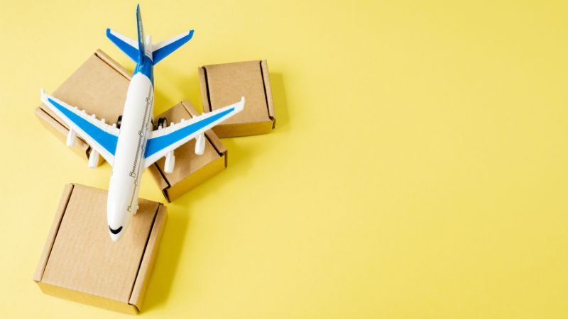 Airplane and stack of cardboard boxes. concept of air cargo