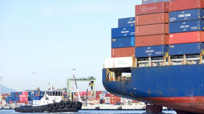 Cargo ship with containers at the port, maritime freight transportation, shipping logistics, international trade, industry, Commerce, transport.