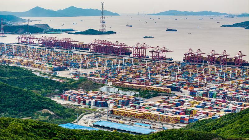 Ninbo Zhoushan Container port with cargo ships and cranes at sea, emphasizing logistics, shipping, and transportation infrastructure for efficient global trade.